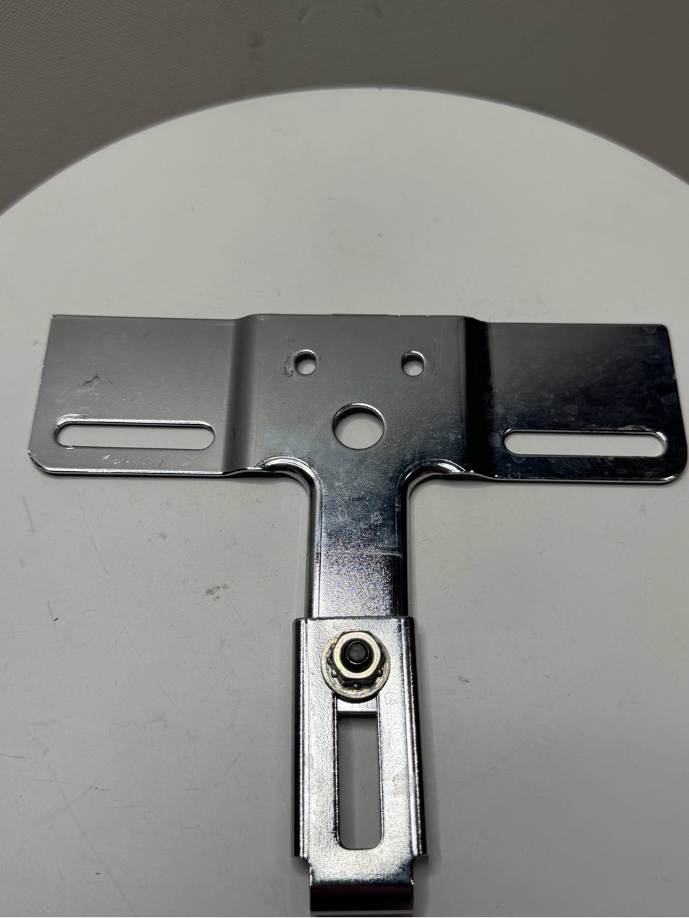 Chrome adjustable license plate bracket for Harley-Davidson motorcycles.